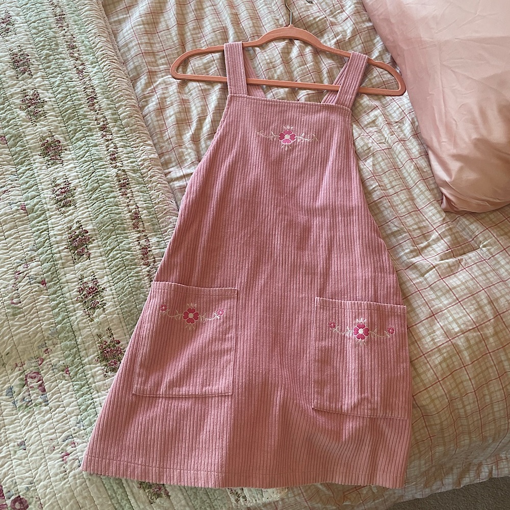 XS Pink, corduroy overall dress with embroidered flowers.